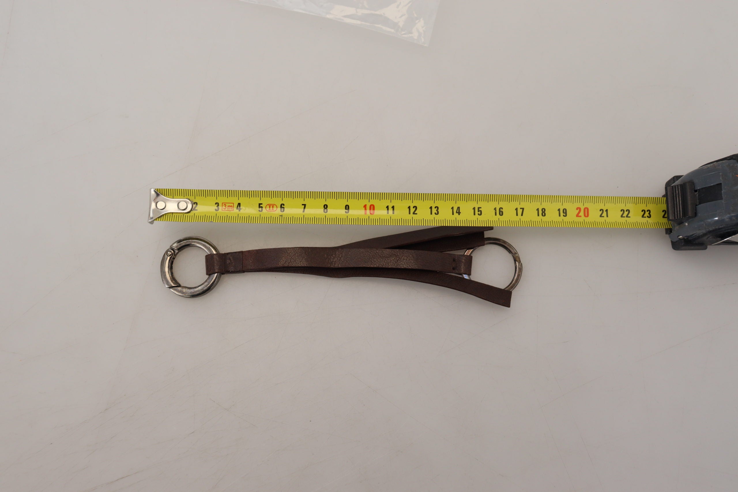 Porte-clés en cuir marron et métal argenté Costume National