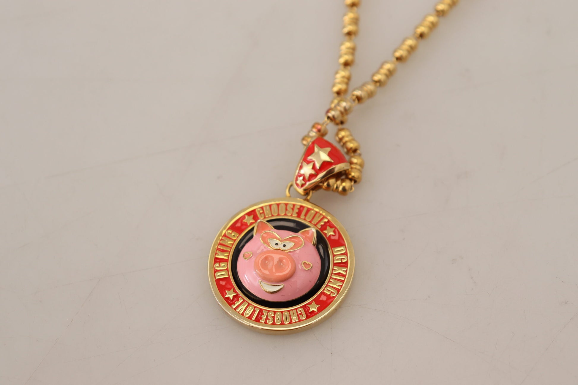 Collier Dolce &amp; Gabbana avec pendentif logo SUPER PIG en laiton doré