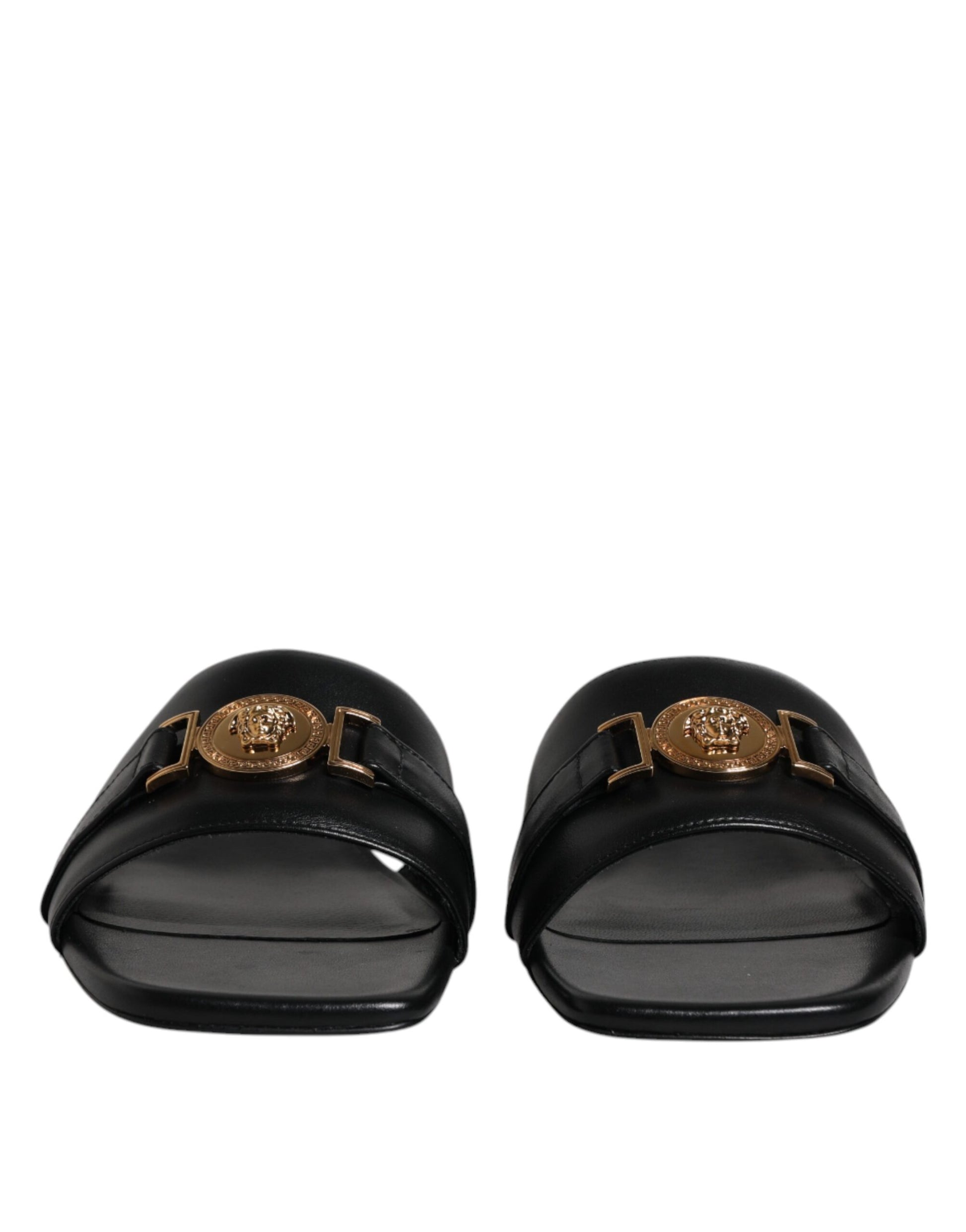 Claquettes plates à enfiler en cuir noir avec plaque logo Versace