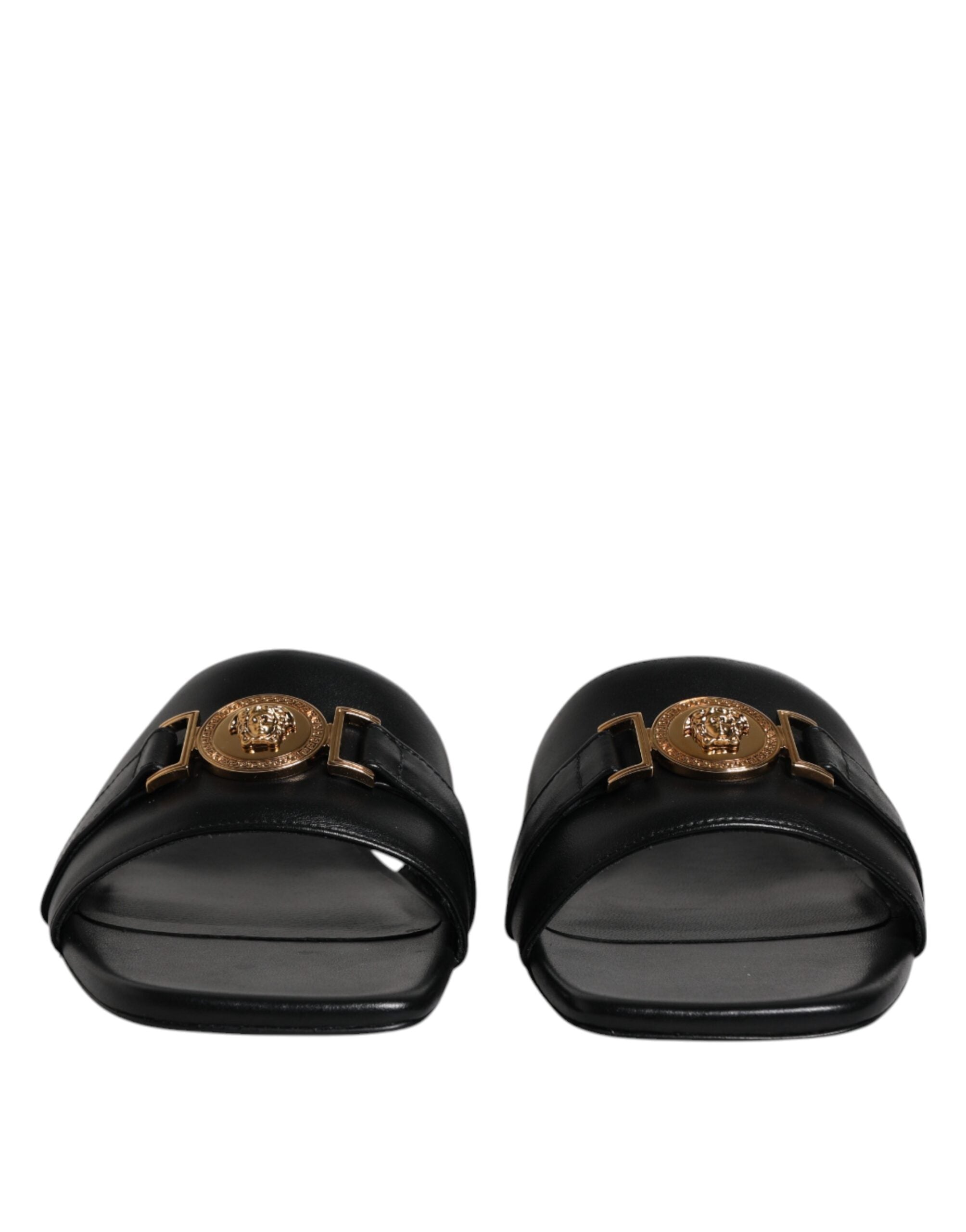 Claquettes plates à enfiler en cuir noir avec plaque logo Versace