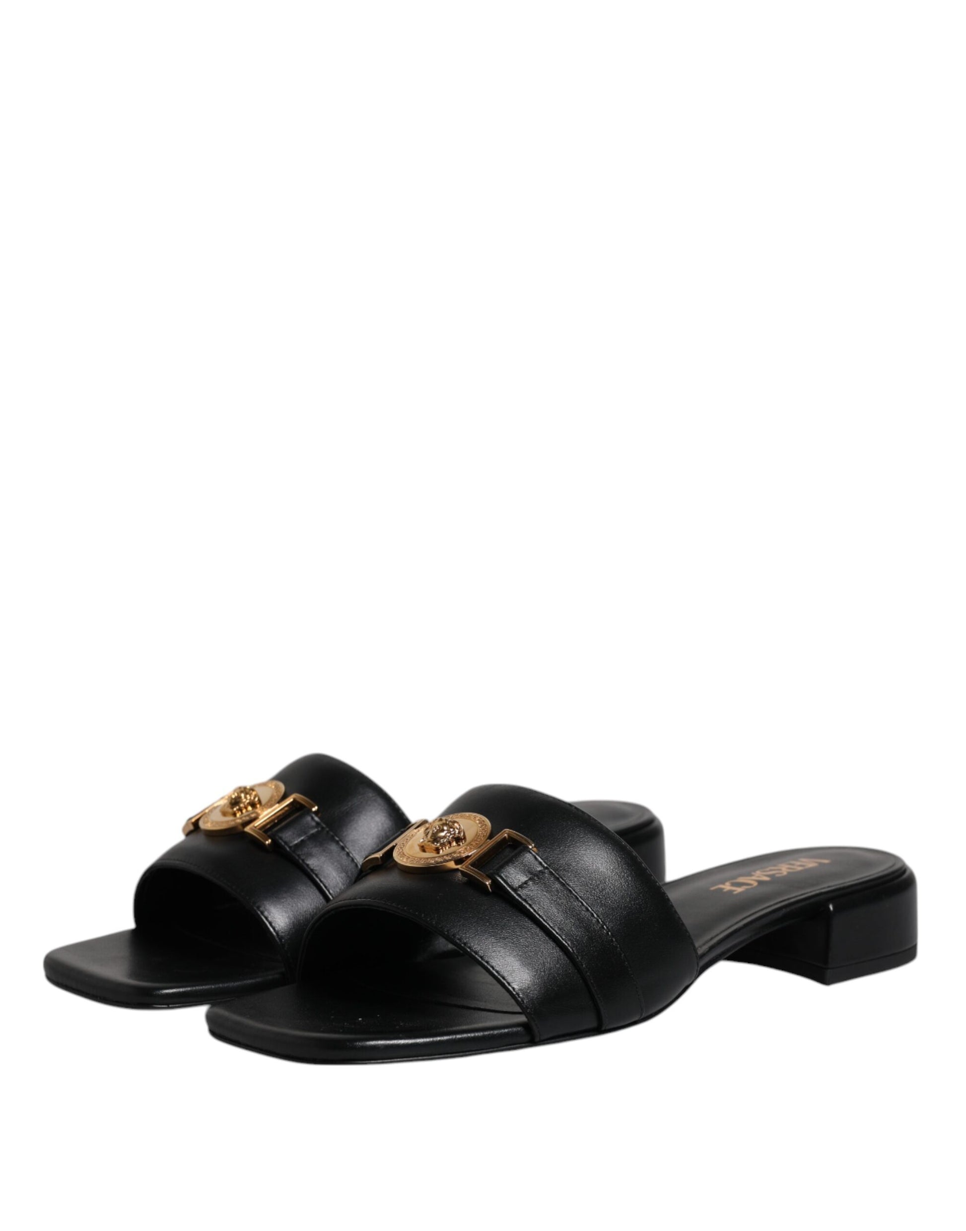 Claquettes plates à enfiler en cuir noir avec plaque logo Versace