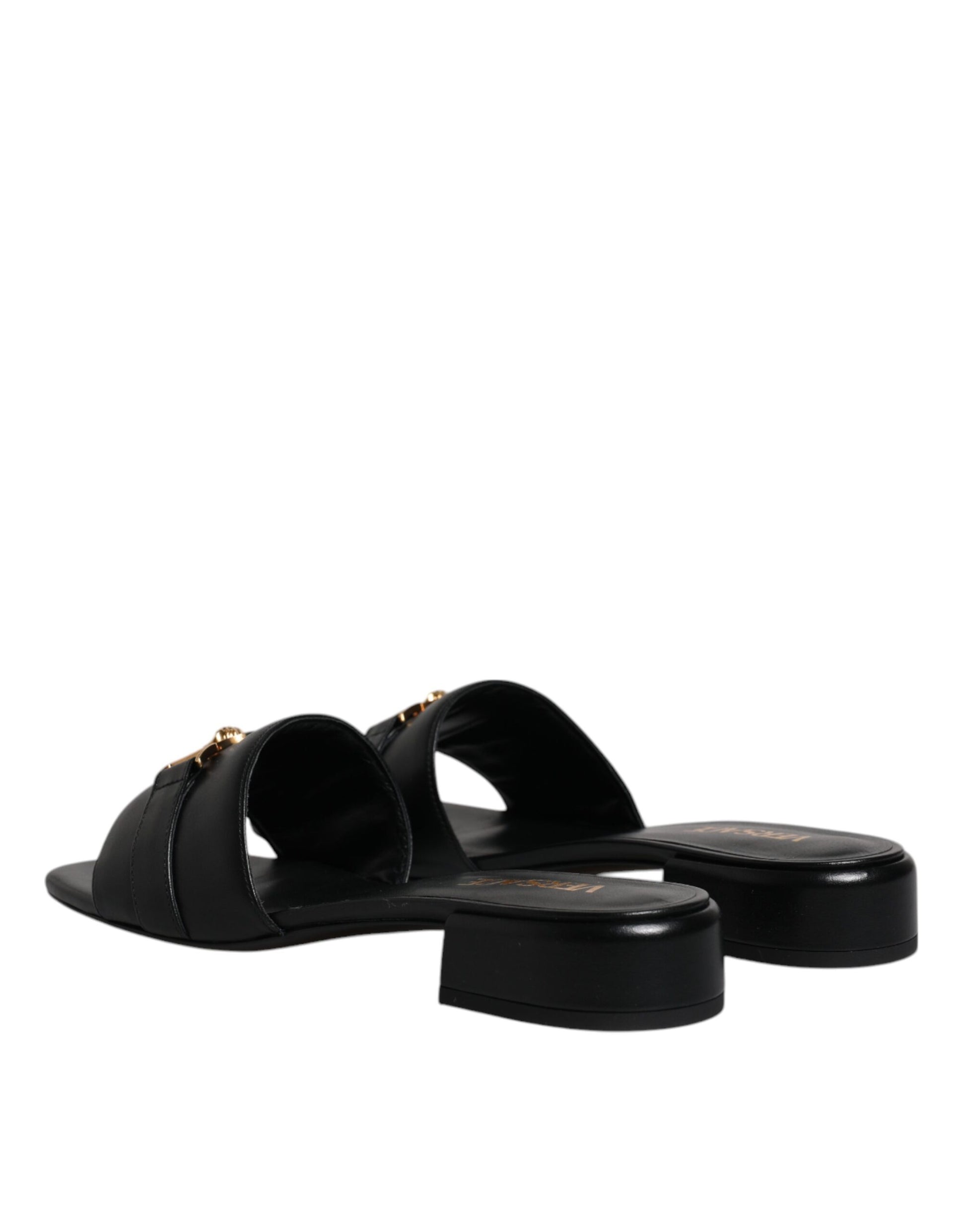 Claquettes plates à enfiler en cuir noir avec plaque logo Versace