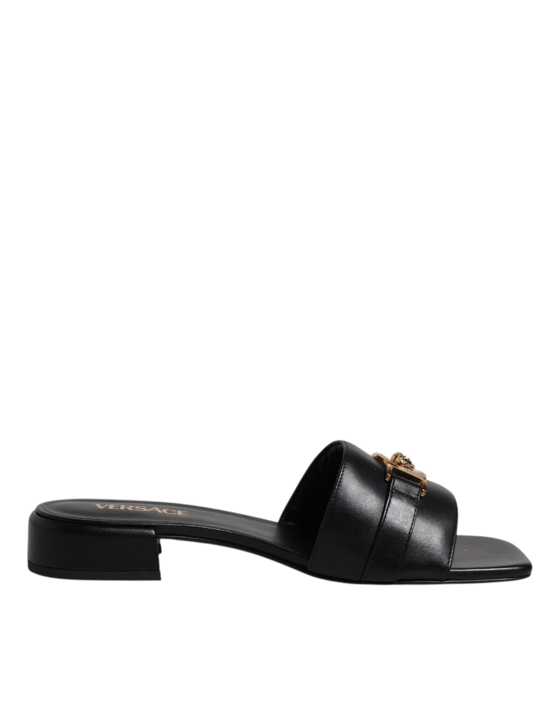 Claquettes plates à enfiler en cuir noir avec plaque logo Versace