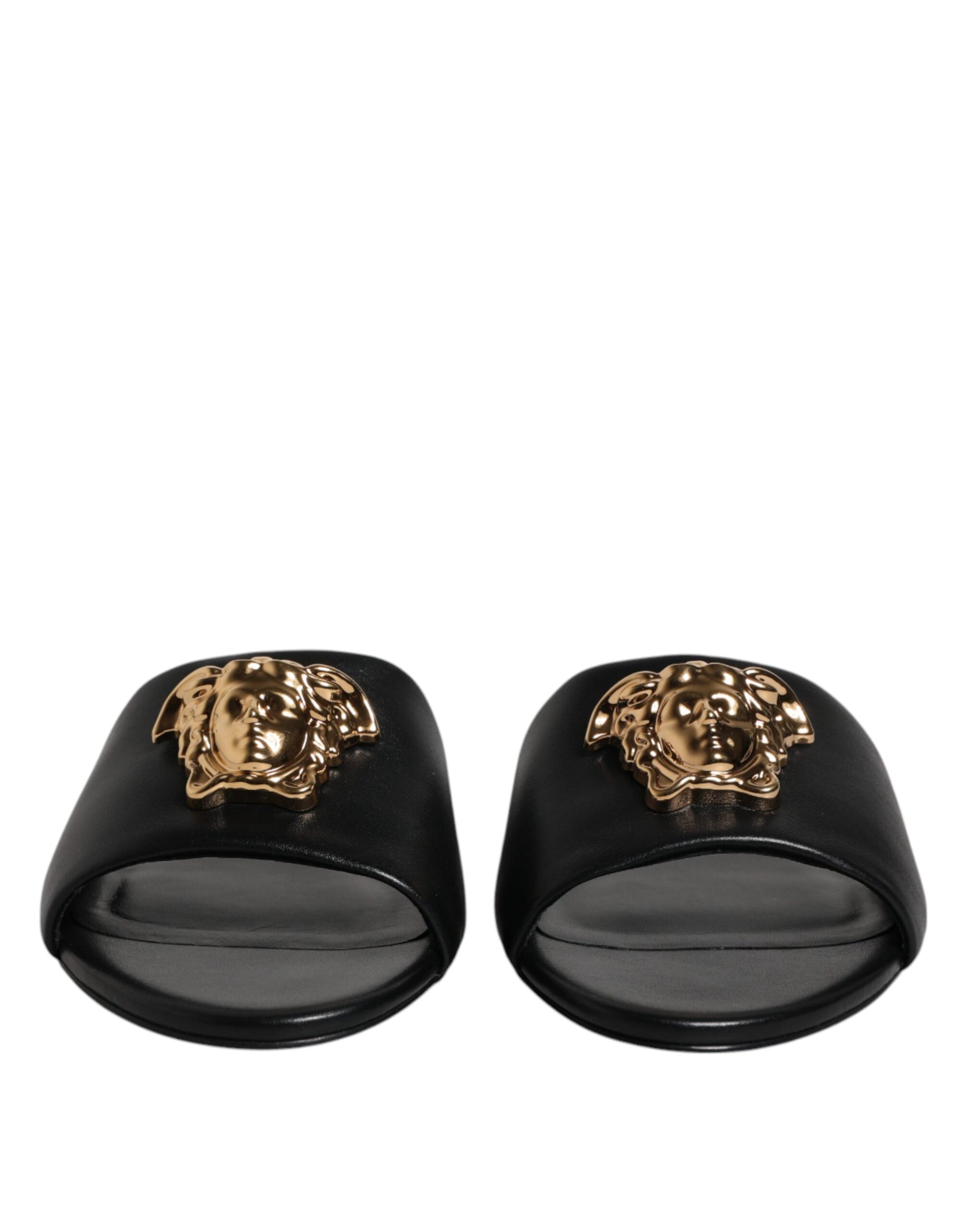 Claquettes plates à enfiler en cuir noir avec plaque logo Versace