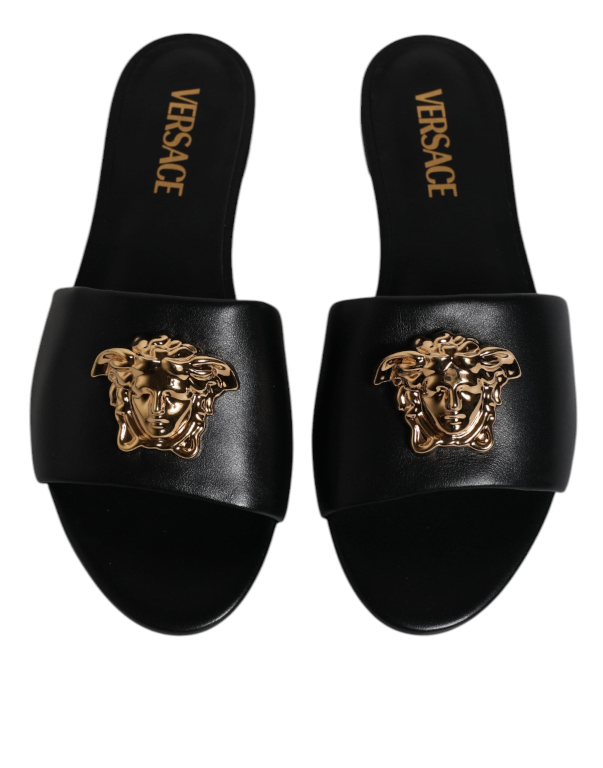 Claquettes plates à enfiler en cuir noir avec plaque logo Versace