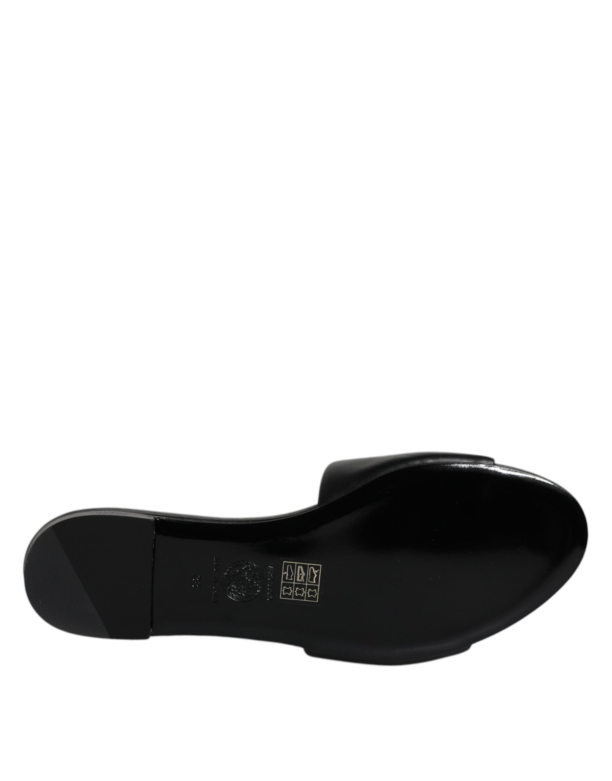 Claquettes plates à enfiler en cuir noir avec plaque logo Versace