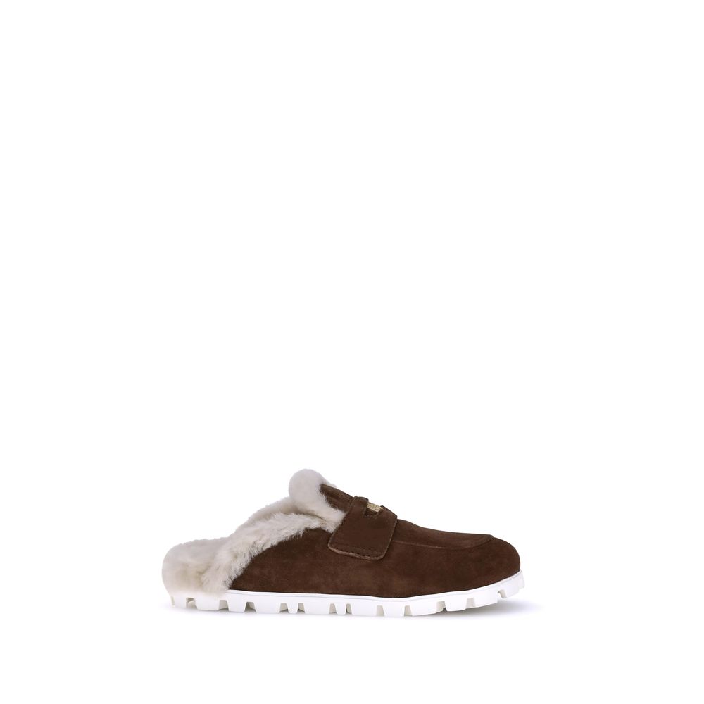 Mules en peau lainée Miu Miu