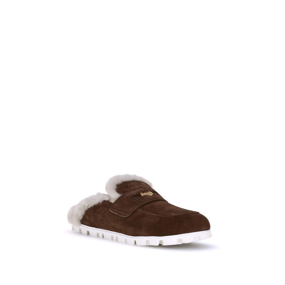 Mules en peau lainée Miu Miu