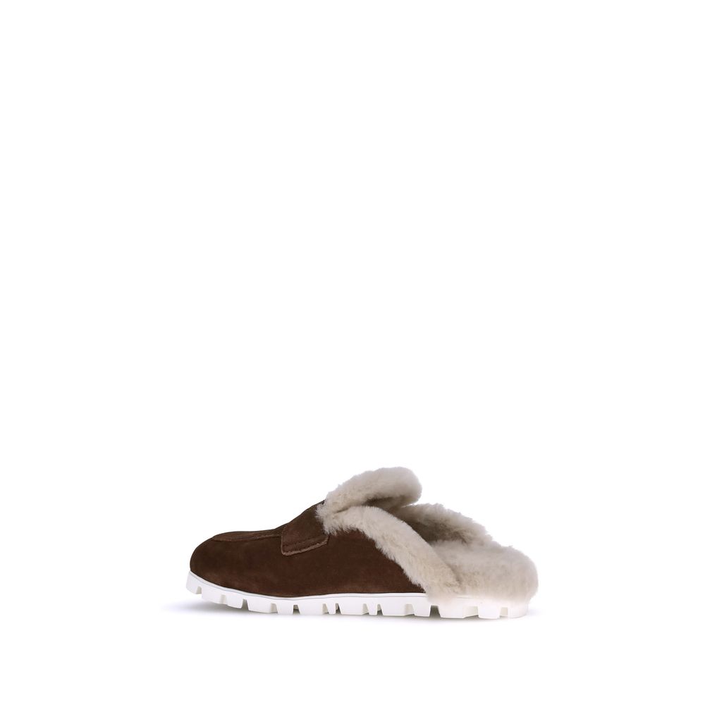 Mules en peau lainée Miu Miu